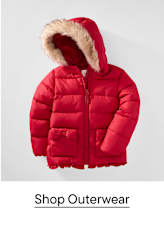 A red puffer jacket with a faux-fur trimmed hood is centered against a plain light gray background.