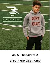 The image shows a young man wearing a gray hoodie with the text "DON'T QUIT" printed on it, standing on a grassy field with the "3BRAND" logo visible in the background.