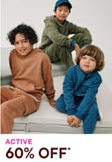 Three children, two boys and one girl, sitting on a bench and wearing casual clothing in various colors.
