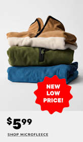 A stack of folded microfleece clothing items, including a tan, white, and olive green garment, with a blue garment on top displaying a cartoon character logo, accompanied by a 60% off sale promotion.