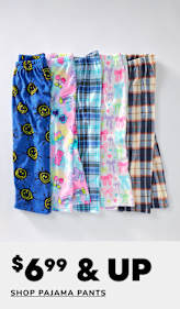 A collection of colorful and patterned pajama pants, including designs with smiley faces, floral prints, and plaid, arranged on a plain background with a "60% off" sale sign.