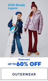Two young children wearing warm, hooded jackets and winter boots stand in the foreground, with the text "Chill-Ready Layers" and "Outerwear up to 70% OFF" displayed in the background.
