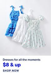 Three children's dresses, one blue floral, one white, and one light blue cherry print, are displayed against a plain white background with text below advertising them as "Dresses for all the moments" starting at "$8 & up" with a "SHOP NOW" button.