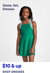 A young girl in a green dress stands against a plain white background, with text below advertising dresses.
