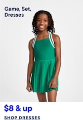 A young girl in a green dress stands against a plain white background, with text below advertising dresses.