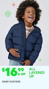 A young child with curly hair wearing a navy blue puffy jacket is smiling brightly against a plain white background with green and red graphics.