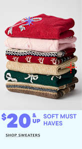 A stack of colorful, patterned sweaters with a price tag of $20 and up, accompanied by the text "Soft must haves" promoting the sale of sweaters.