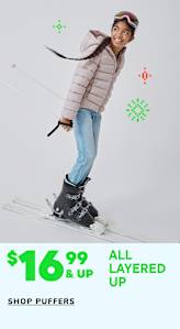 A young child with curly hair wearing a navy blue puffy jacket is smiling brightly against a plain white background with green and red graphics.