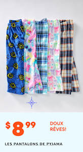 Une collection de pantalons de pyjama colorés et à motifs, comprenant des modèles avec des visages souriants, des papillons et des carreaux, est présentée sur un fond uni avec une étiquette de prix de 8,99 $ pour les pantalons de pyjama « Doux rêves ! ».