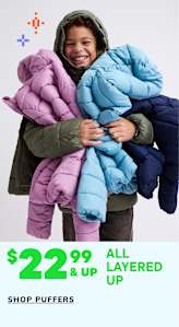 A person wearing a warm, colorful puffer jacket is smiling and surrounded by various puffer jackets of different colors displayed on a white background.