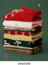 A stack of colorful, patterned sweaters against a dark green background.