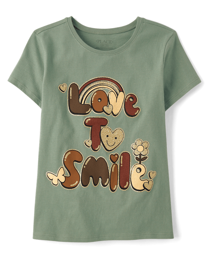 T-shirt graphique « Les filles adorent sourire »