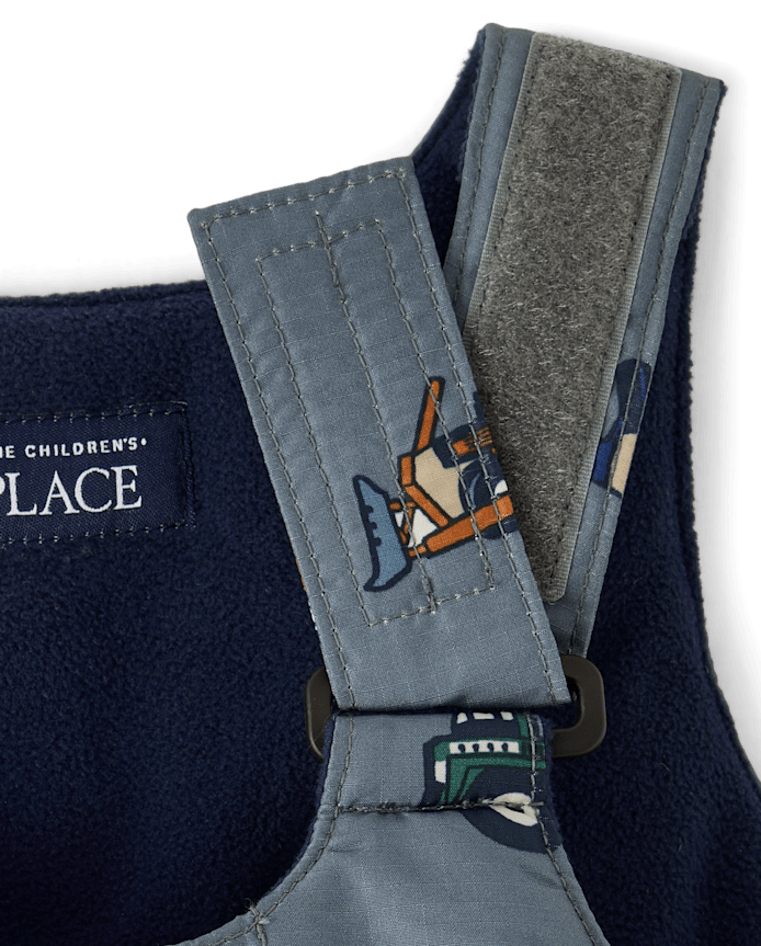 Salopette de neige pour petit garçon en forme véhicule chantier