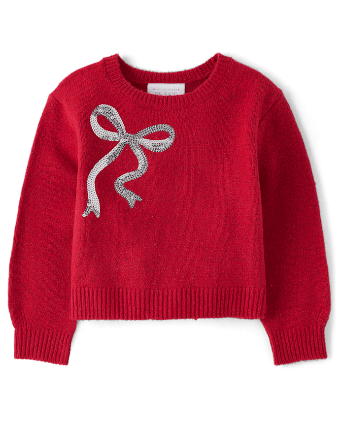 Pull à paillettes et nœud pour petite fille