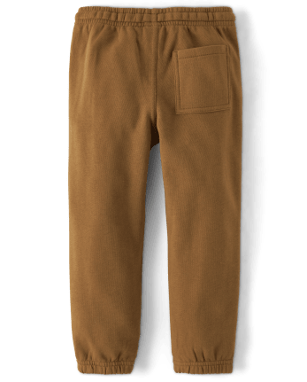Pantalones jogger de forro polar con renos bordados para niños - Cabina de Navidad