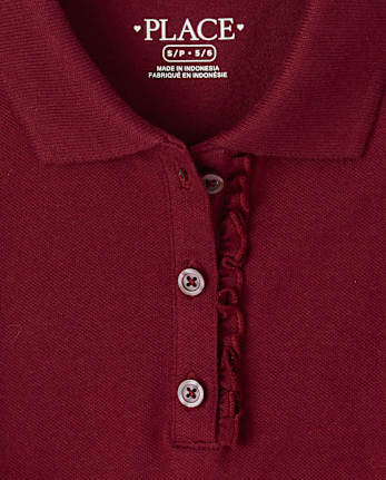 Polo de piqué con volantes de uniforme para niñas