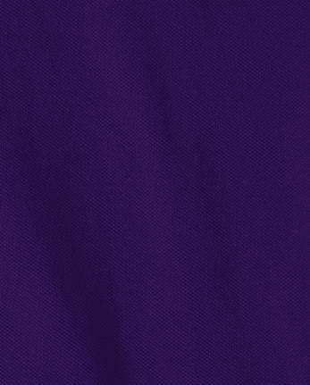 Polo de piqué con volantes de uniforme para niñas