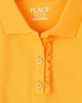 Polo de piqué con volantes de uniforme para niñas