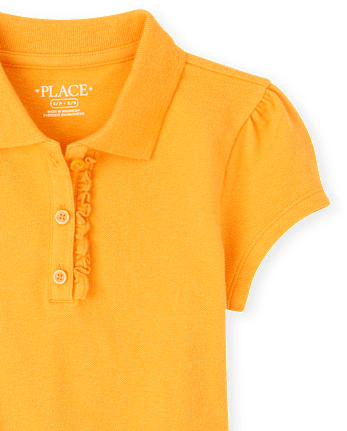 Polo de piqué con volantes de uniforme para niñas