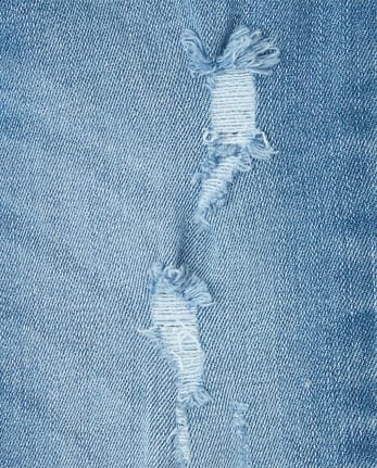 Pantalones de mezclilla súper ajustados con dobladillo desgastado para niñas