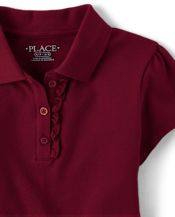 Polo de piqué con volantes de uniforme para niñas
