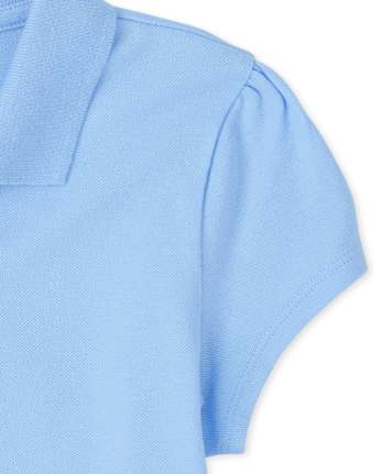 Polo de piqué con volantes de uniforme para niñas