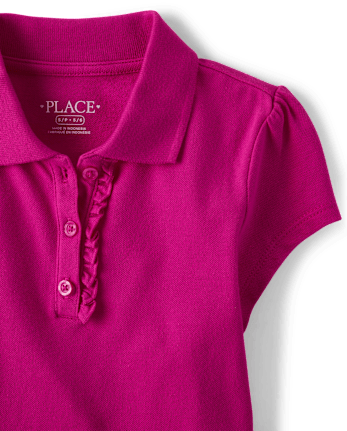 Polo de piqué con volantes de uniforme para niñas