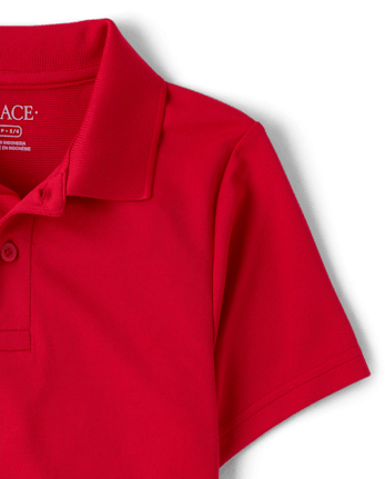 Polo de rendimiento de uniforme para niños
