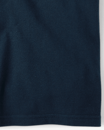 Polo de piqué elástico resistente a las manchas de uniforme para niños