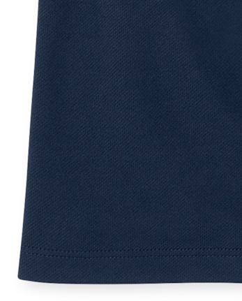 Polo de performance uniforme pour filles