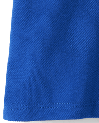 Polo de piqué con volantes de uniforme para niñas pequeñas