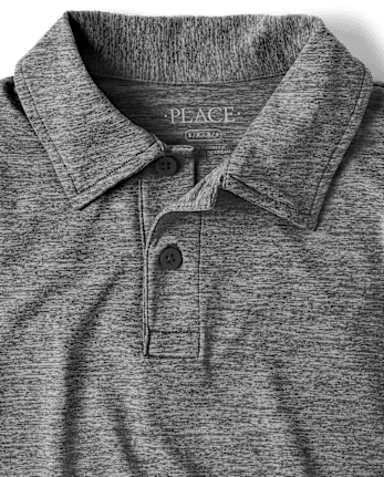 Polo de rendimiento jaspeado uniforme para niños