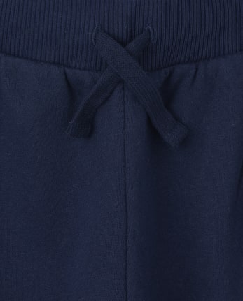 Pantalones jogger de vellón con rayas laterales para niños