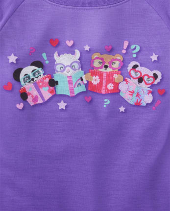 Pijamas de animales leyendo para niñas