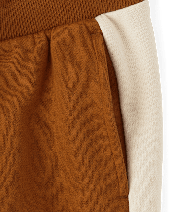 Pantalones jogger de polar con rayas laterales para niños