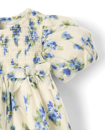 Robe à smocks et nœud floral assortie pour bébé fille