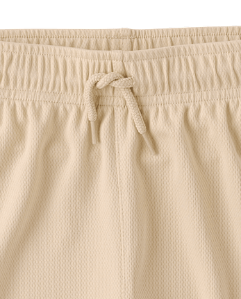 Short de sport enfant à séchage rapide et bandes latérales en maille