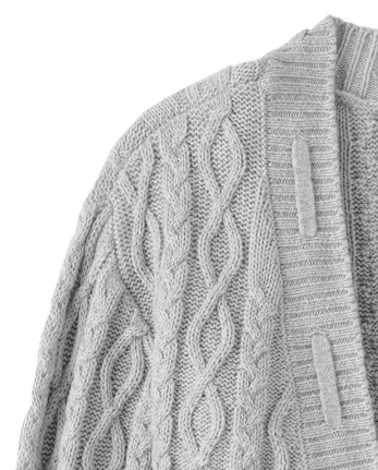 Gilet en maille torsadée à lacets et nœud pour fille