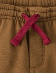 Pantalones jogger de forro polar con renos bordados para niños - Cabina de Navidad