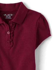 Polo de piqué con volantes de uniforme para niñas