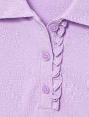 Polo de piqué con volantes de uniforme para niñas