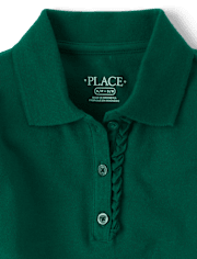 Polo de piqué con volantes de uniforme para niñas
