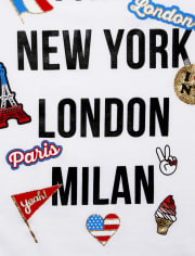 Camiseta con gráfico de emoji con purpurina para niñas 'Paris New York London Milan'