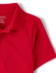 Polo de rendimiento de uniforme para niños
