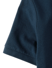 Polo de piqué elástico resistente a las manchas de uniforme para niños