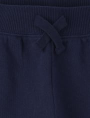 Pantalones jogger de rizo francés con rayas laterales activas para bebés y niños pequeños