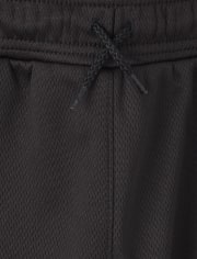 Pantalones jogger de malla con rayas laterales para niños