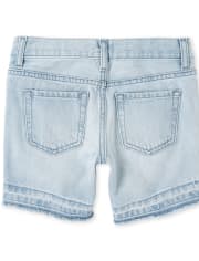 Shorts midi de mezclilla desgastada con bajo bajo para niñas