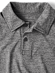 Polo de rendimiento jaspeado uniforme para niños