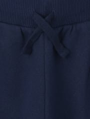 Pantalones jogger de vellón con rayas laterales para niños